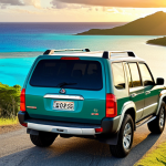 **Image Prompt 1: Coastal Freedom & Sunset Discovery**
    A sleek 4x4 vehicle is parked on a winding scenic coastal road in New Caledonia, overlooking a breathtaking turquoise lagoon and vibrant green islands. The sun is setting, casting warm golden light across the scene, evoking a sense of ultimate freedom and the joy of discovering hidden, serene spots. The car faces away, inviting the viewer to imagine their own journey.